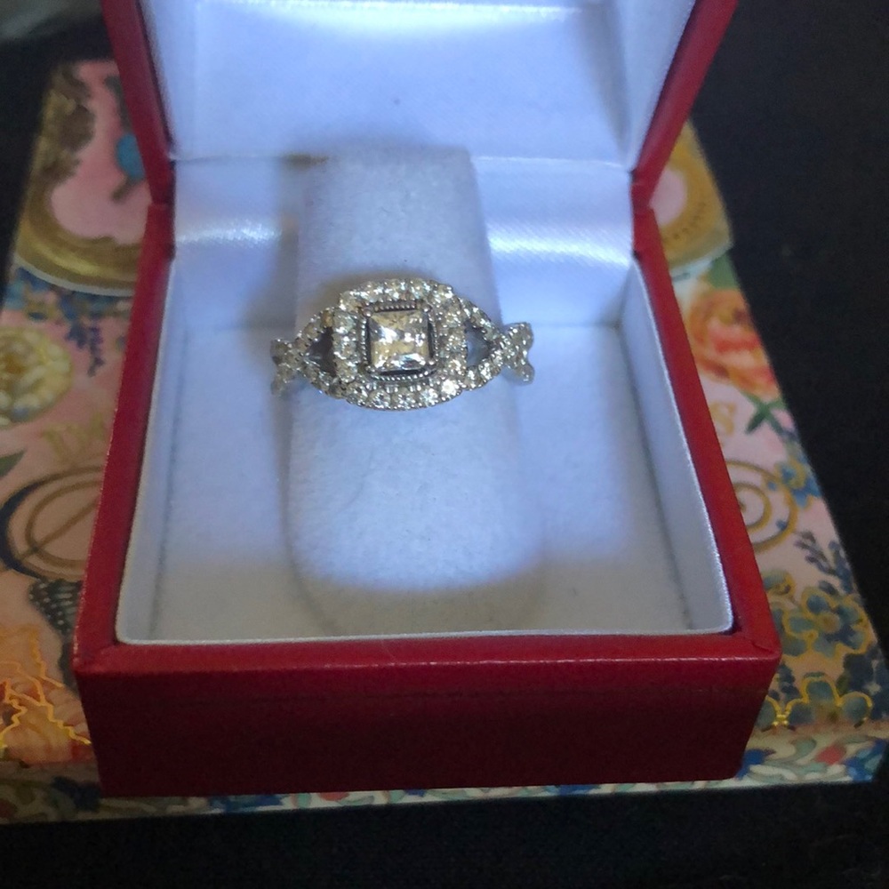 Diamond Engagement Ring. Ribbon weave band with Halo around the center stone